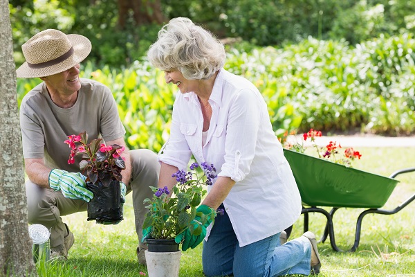 Man and woman potting plants